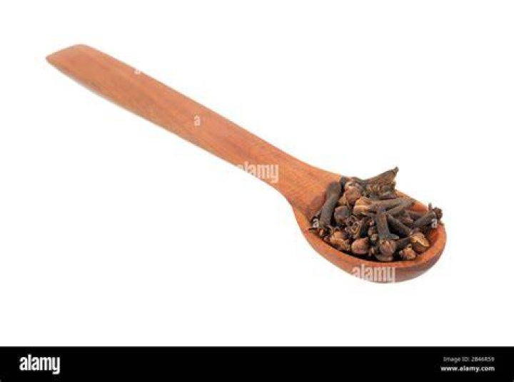 Cloves on a wooden spoon